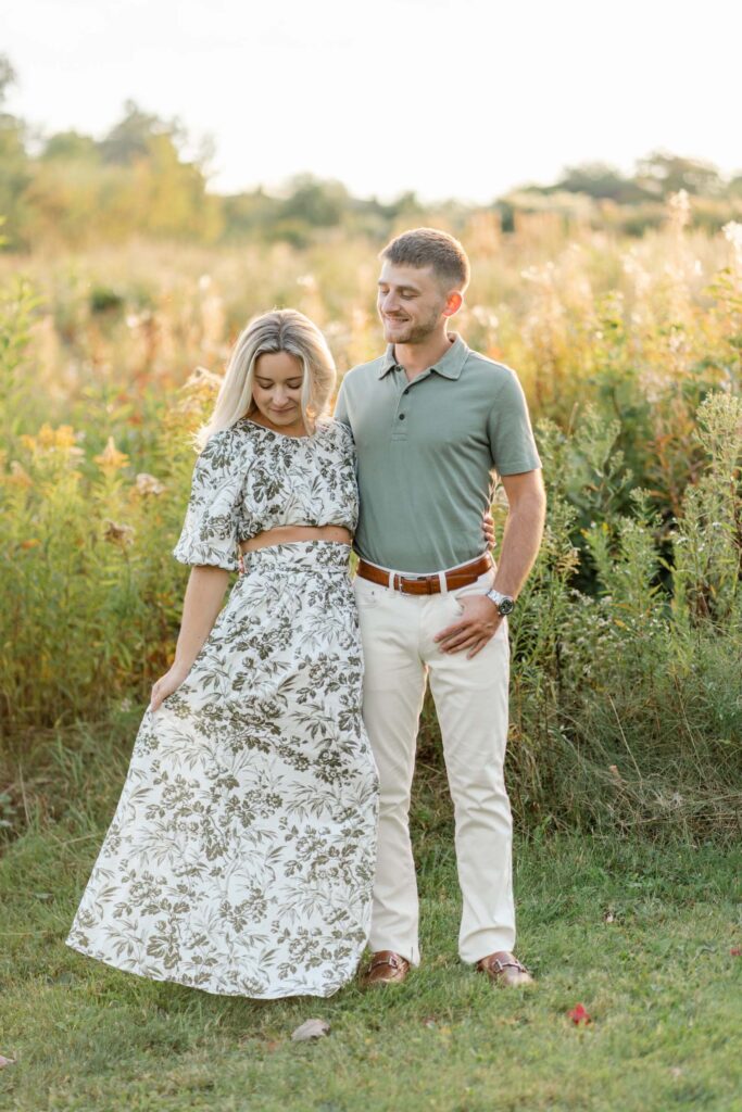 woman looks down at dress sugar hill white mountain engagement session