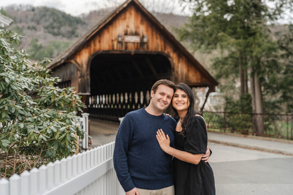 smiling at camera during woodstock covered bridge