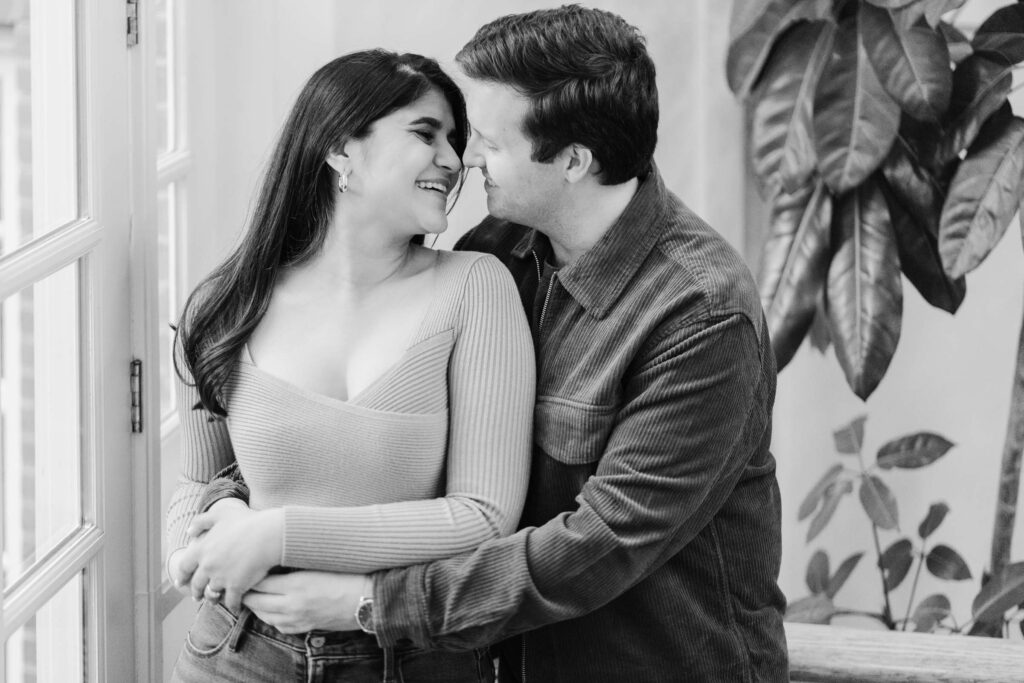 couple snuggling inside, side by side during woodstock vermont engagement session