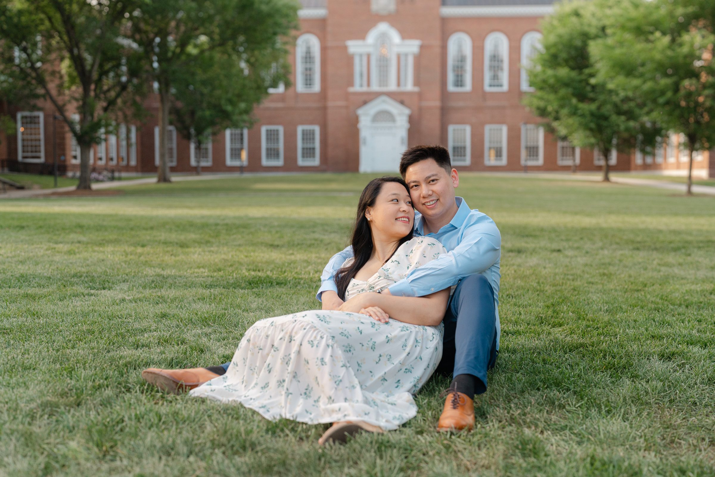 couple cudling in the grass during dartmouth college engagement session
