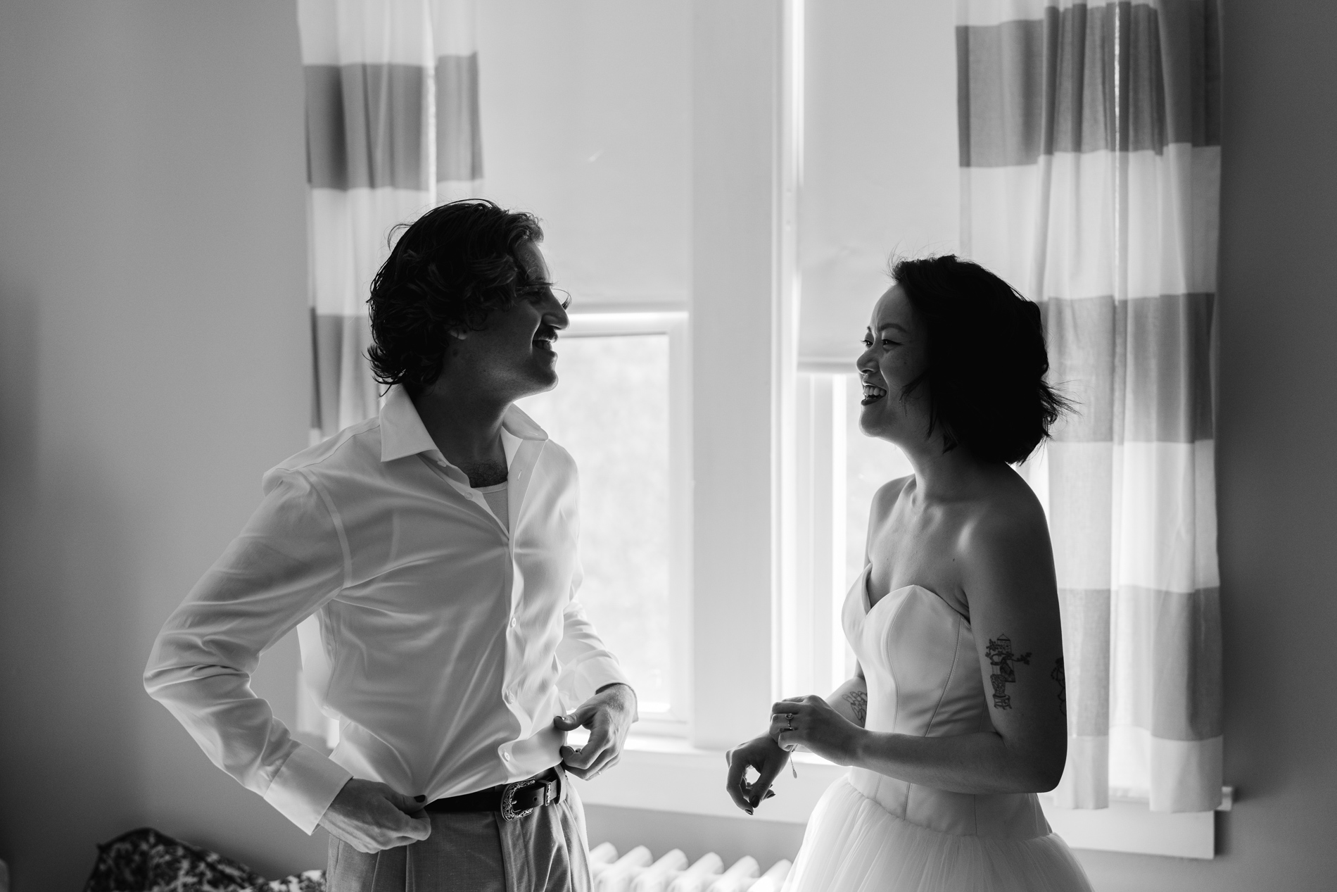 Couple getting ready for wedding day together