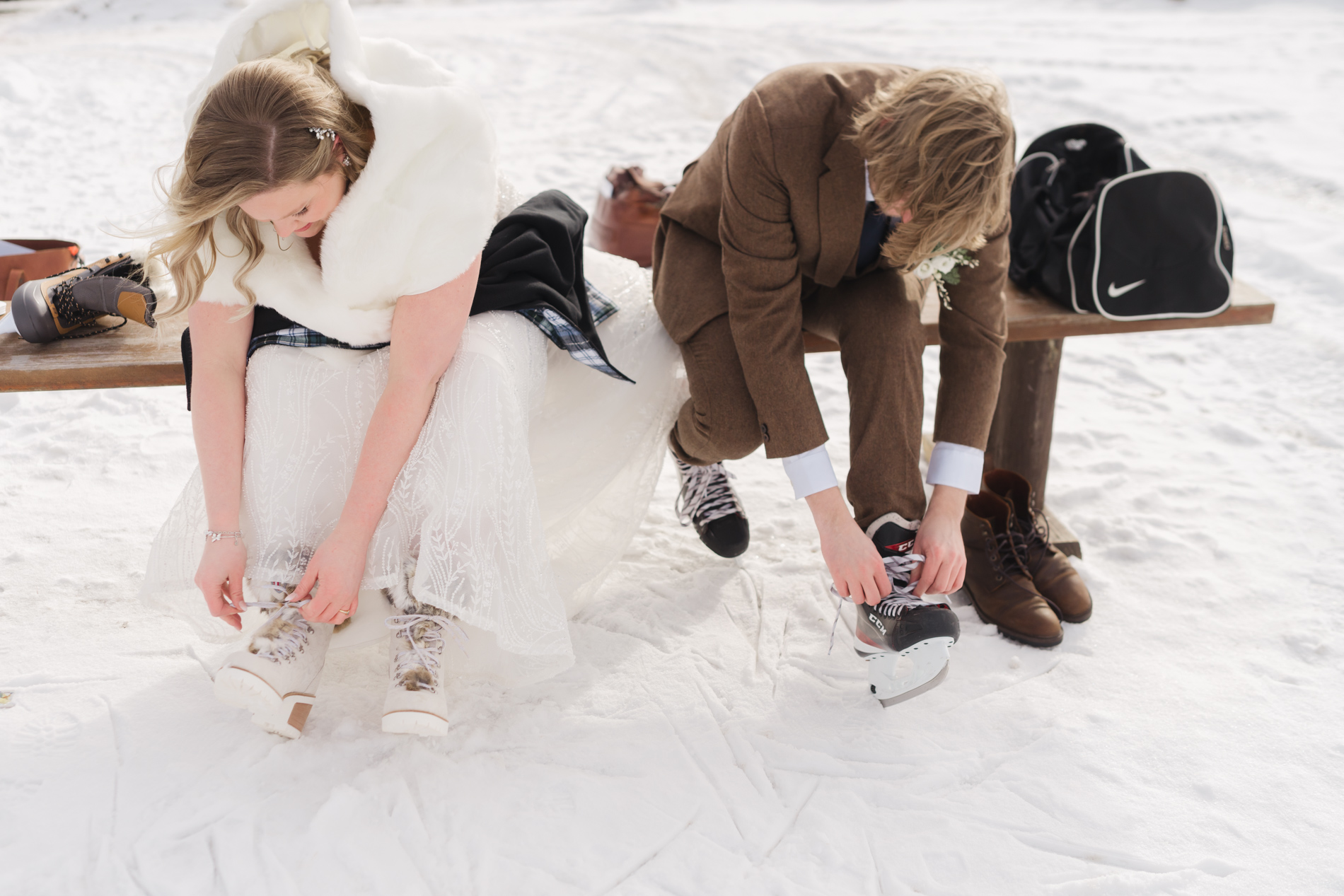 Ice skating first look at Mountain Top Wedding venue, Chittenden, tying ice skates
