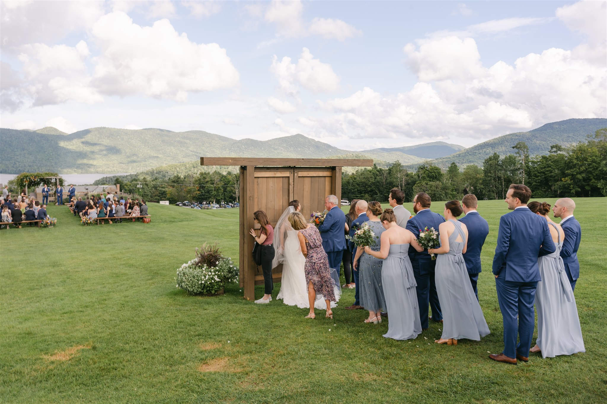 Wedding party lined up behind the door at Mountain Top Inn Wedding awaiting processional
