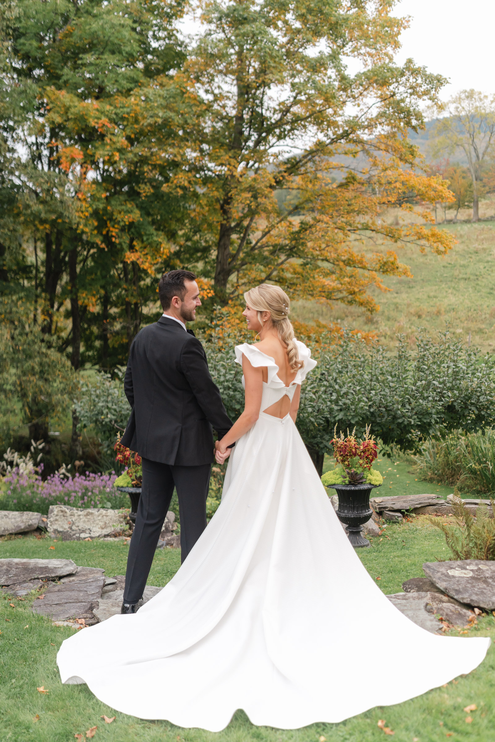 vermont wedding at Inn at round barn portrait of bride and groom and bride's long dress