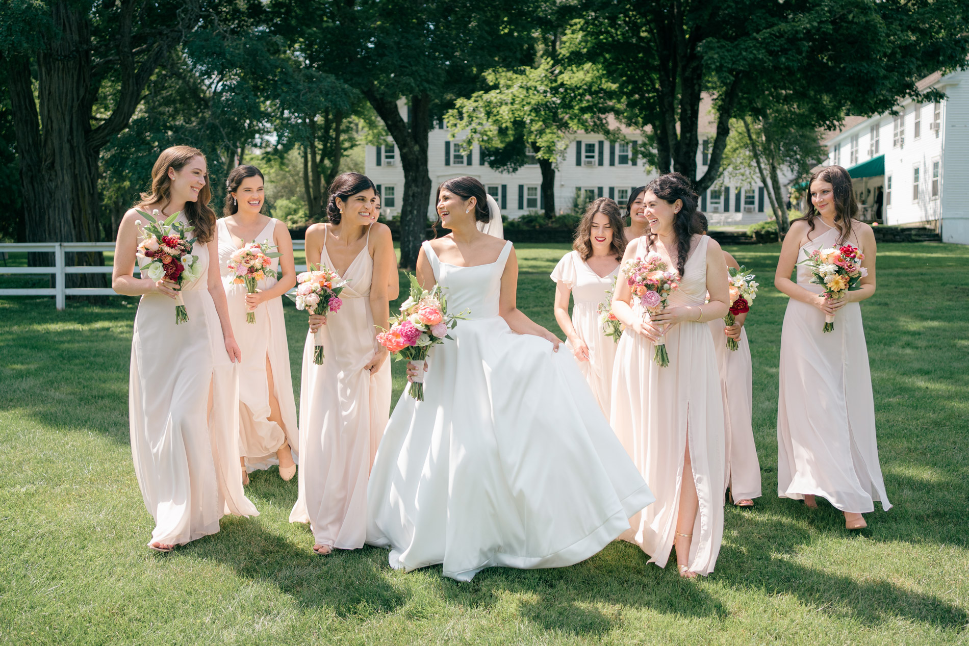 bridal party walking across lawn quechee inn