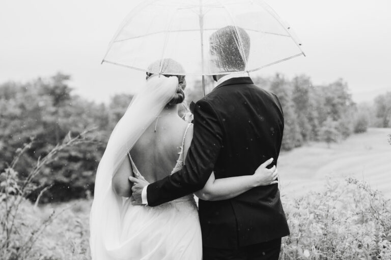 Romantic portrait of bride and groom on a rainy day at Jay Peak wedding
