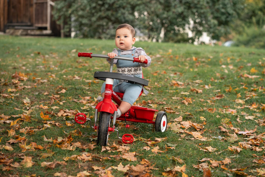 October Family Photos in Woodstock Vermont, young biy on tricycle