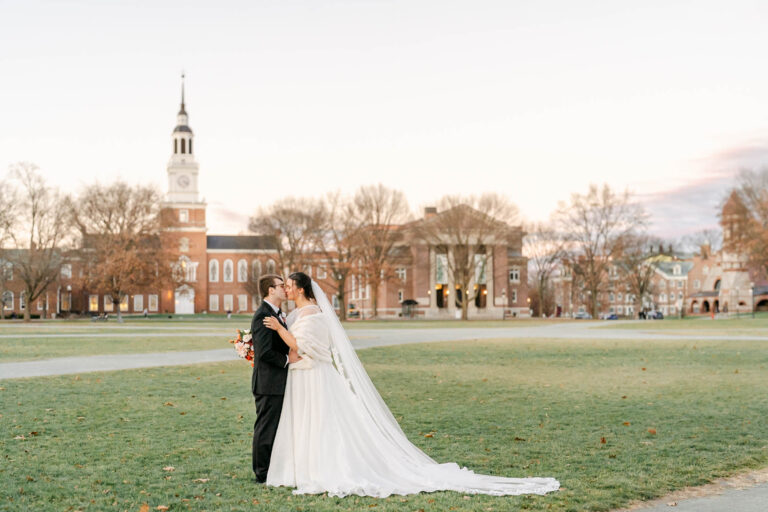 Bride and Groom kissing on green, Hanover Inn, Dartmouth College