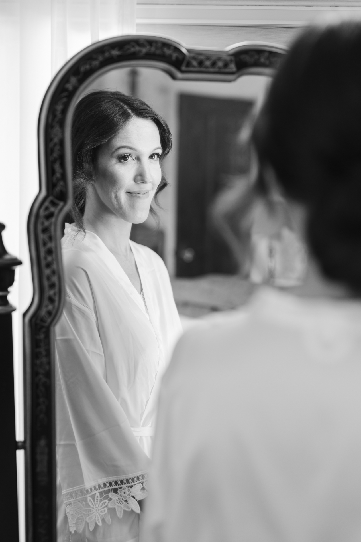new england wedding photographer - photographing wedding at The Wilburton in Manchester, VT - bride looking in mirror