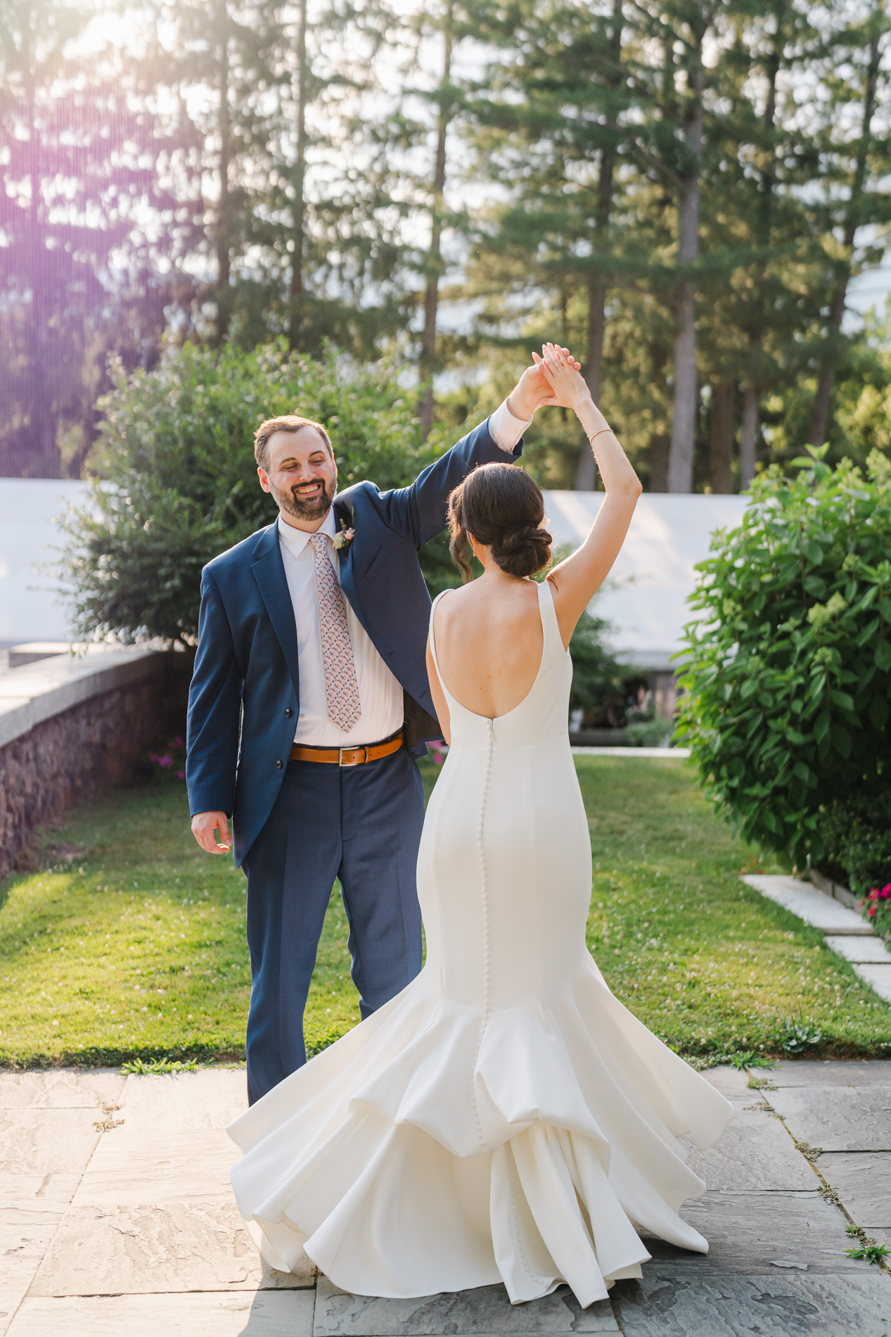 new england wedding photographer - photographing wedding at The Wilburton - groom twirling bride