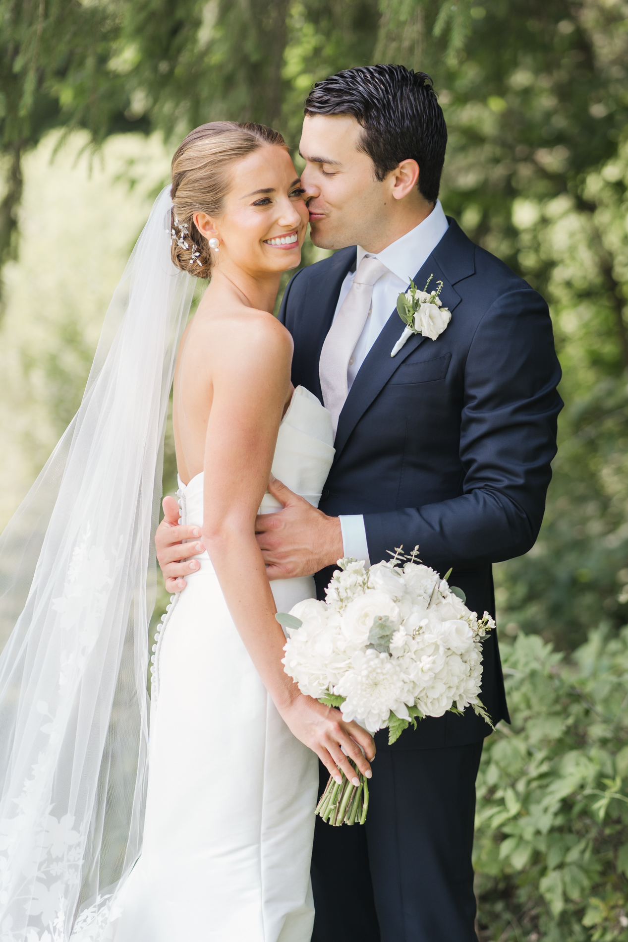 new england wedding photographer - photographing Vermont wedding at Quechee Inn - couple kissing near tree