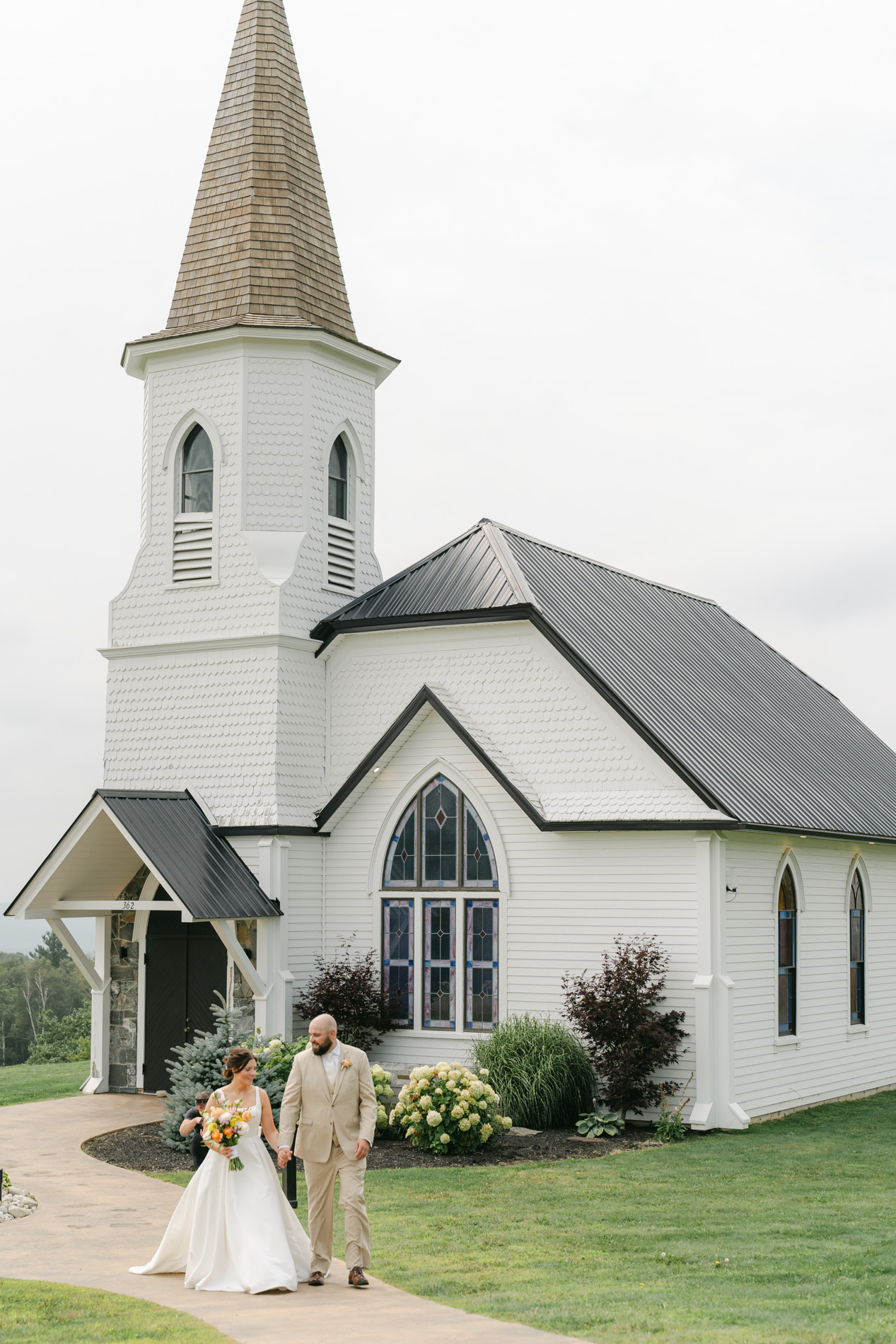 Couple exiting chapel at Barn at the Top of the World