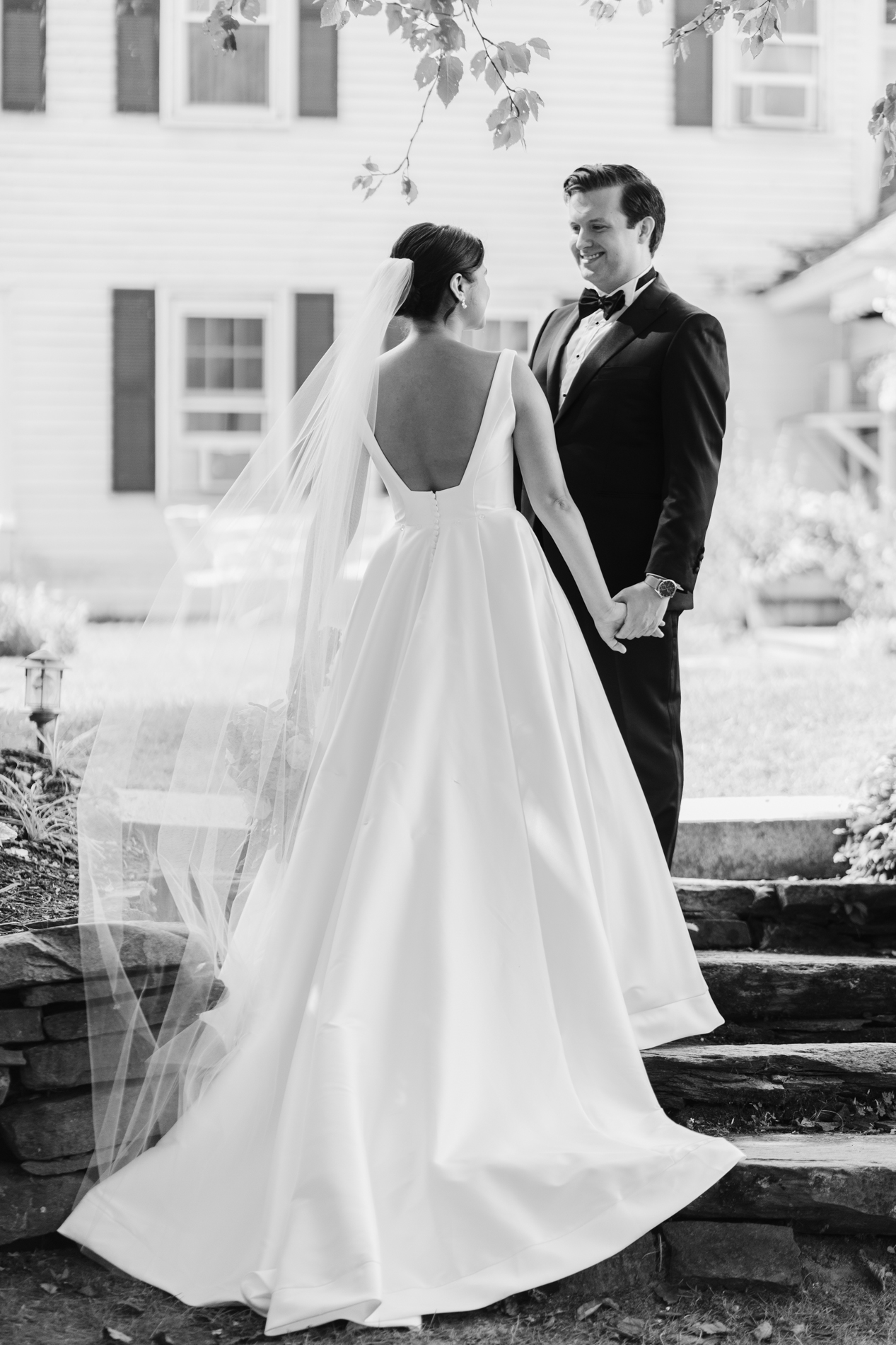 Bride and groom standing on staircase, Quechee Inn Wedding