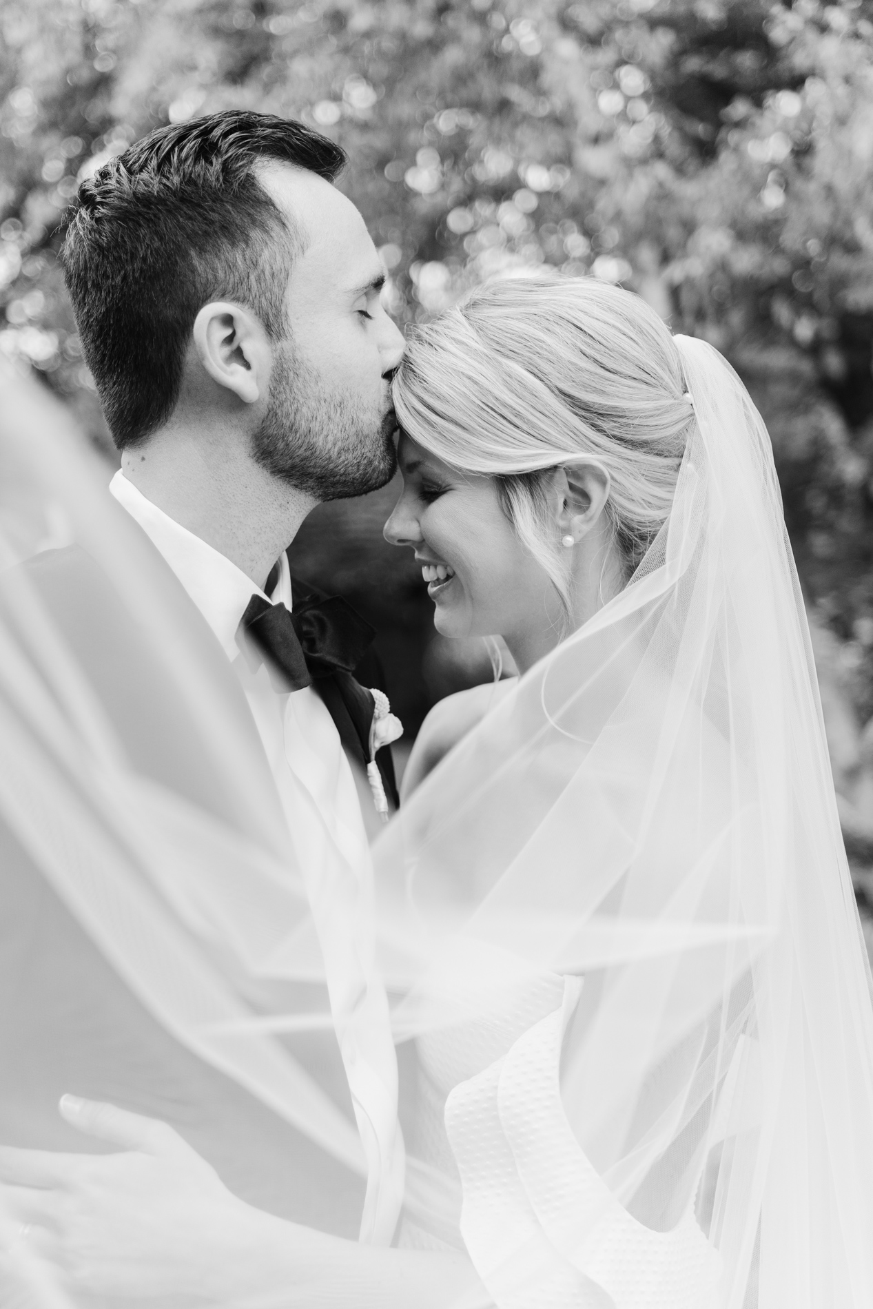 New England Wedding Photographer - Courtney Cania captures Inn at round barn farm wedding - ccouple kissing foreheads