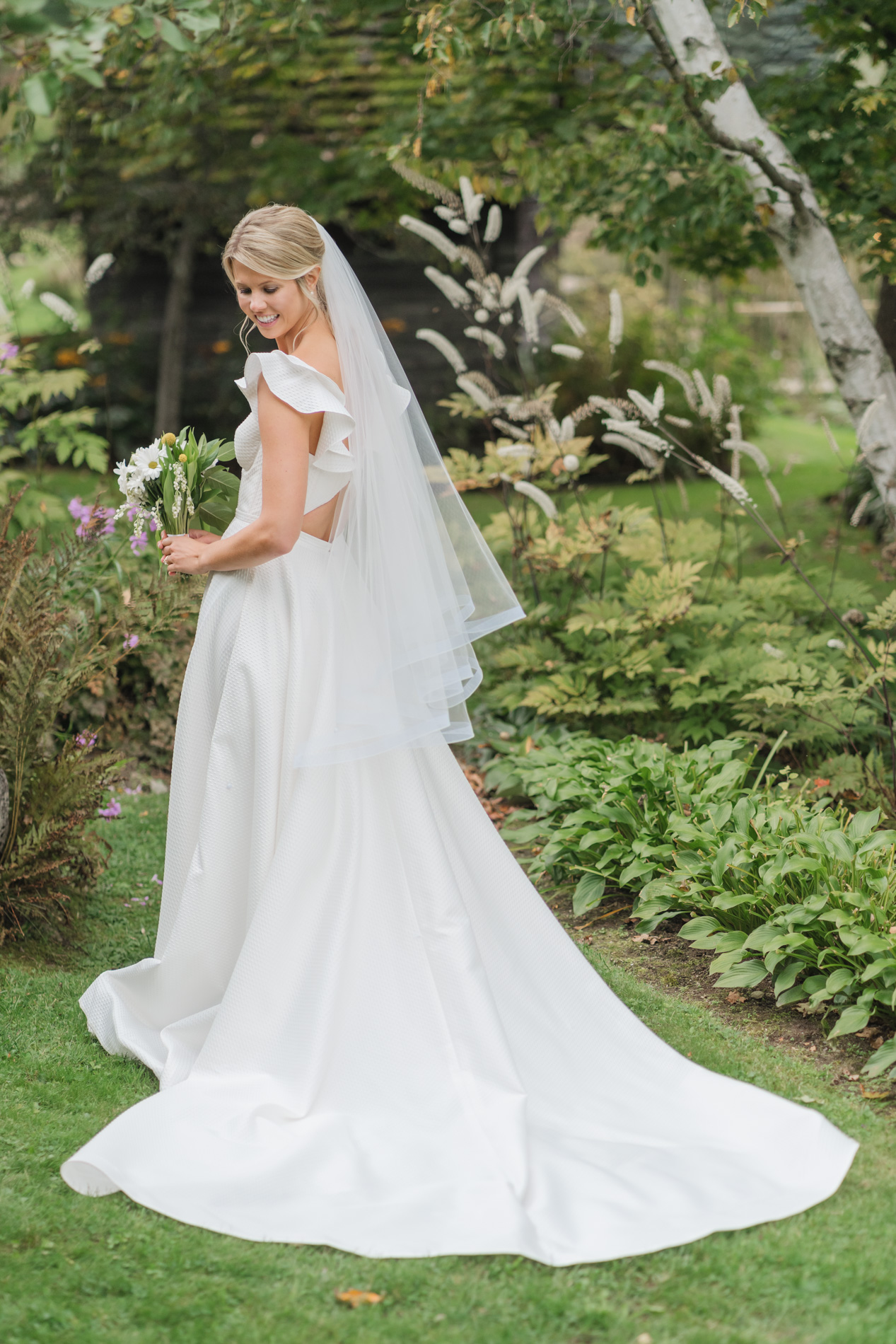 New England Wedding Photographer - Courtney Cania captures Inn at round barn farm wedding - bride posing in gardens