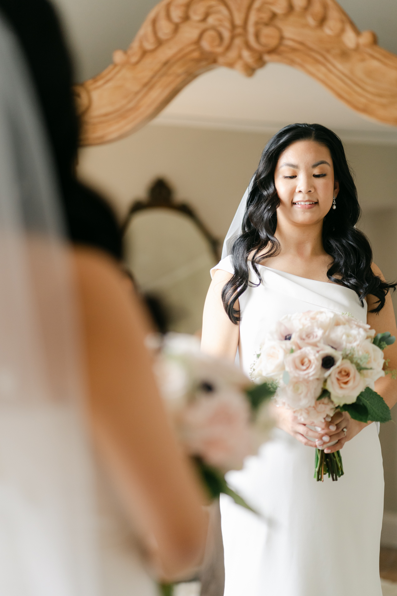 bride looking at self in mirror at Connemara House, Massachusetts