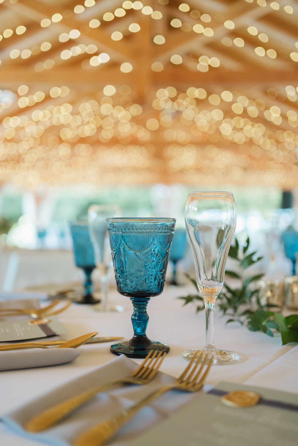 Golden and blue details at wedding at The Fells in Sunapee, NH