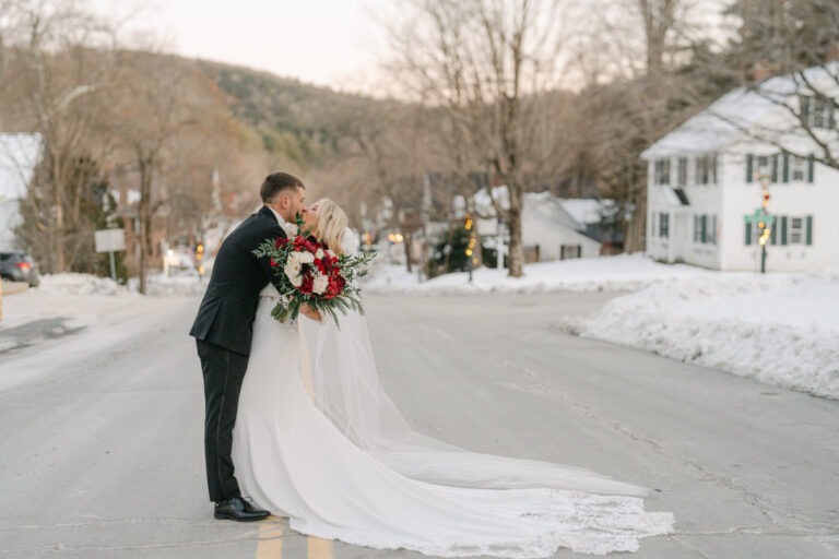 Couple share kiss after wedding ceremony in middle of road, grafton vermont wedding