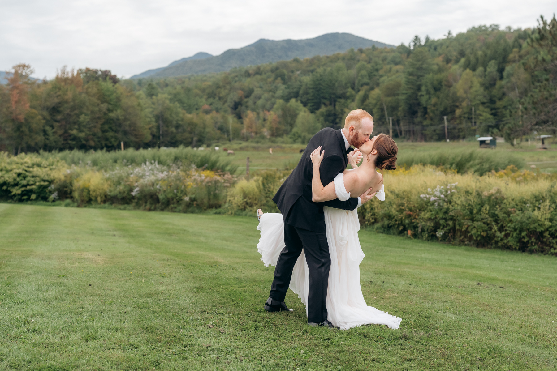 Topnotch Resort Wedding - kiss and dip with mountains in background