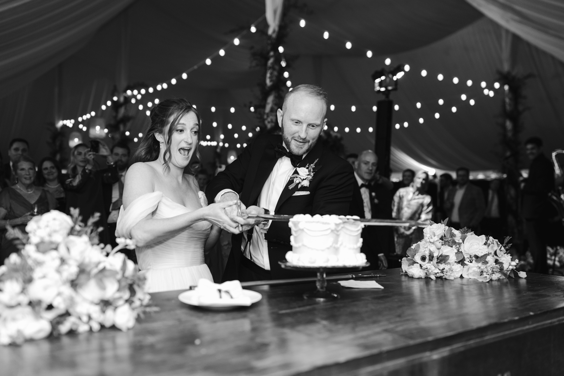 Topnotch Resort Wedding - cutting the cake with a sword