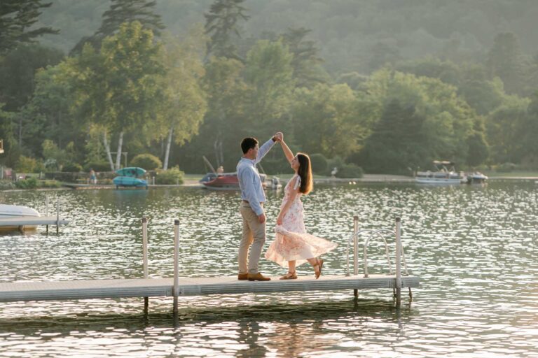 A sunset Lake Morey Engagement Session in Fairlee, Vermont. Couple dancing on the dock