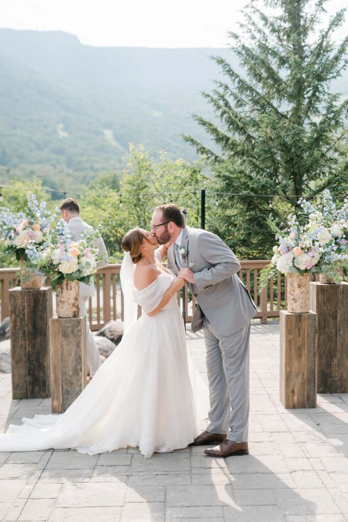 First Kiss, couple getting married in Vermont at the lodge at Sprice Peak