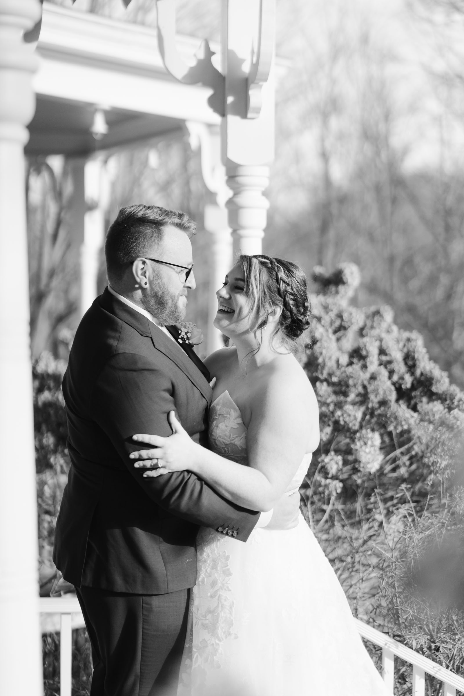 Couple standing on the porch during first look at The Thompson Inn and Cyderhouse Wedding