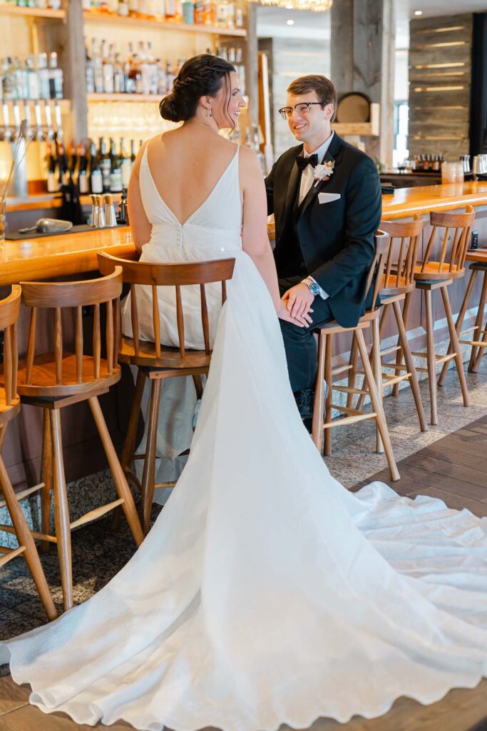 Bride and Groom sitting at bar at Pine at the Hanover Inn