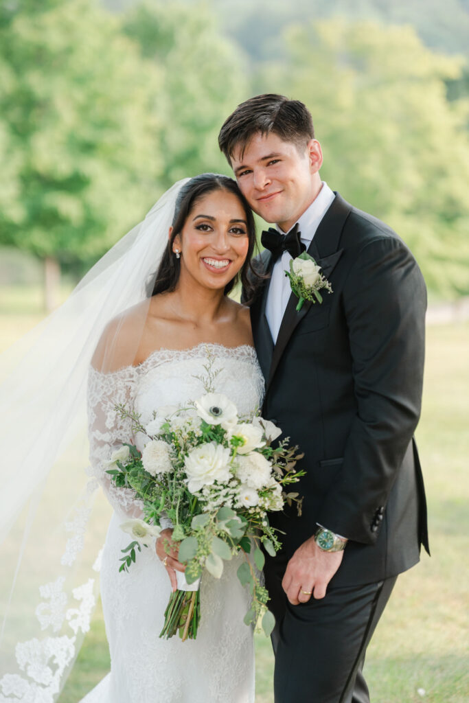 Bride and groom posing together during their portrait session at their wedding at the preserve at chocorua