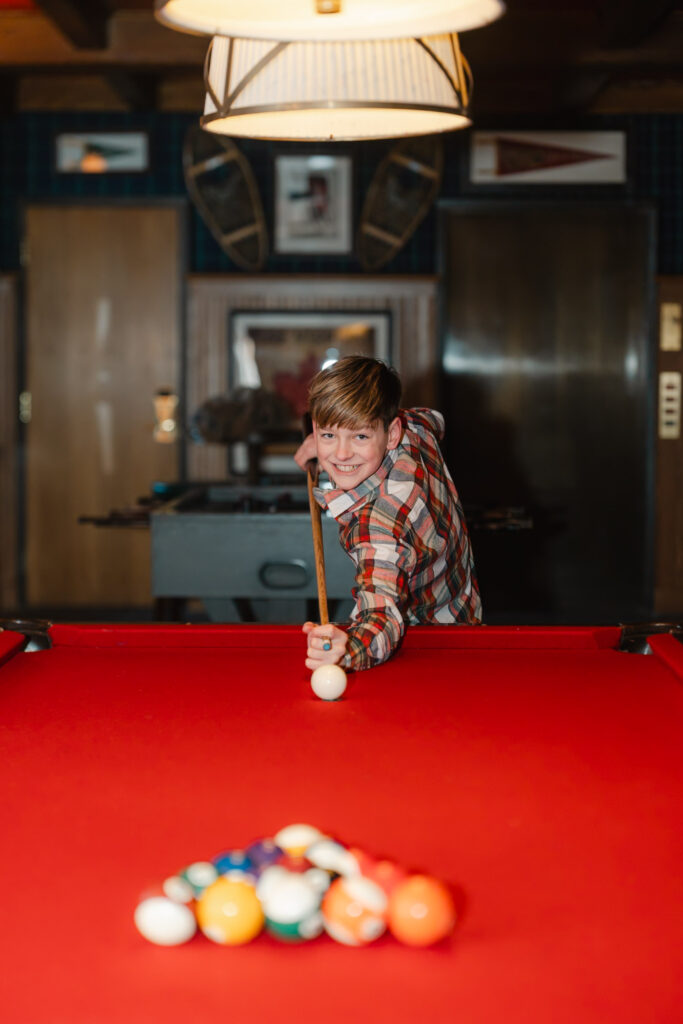 Woodstock, VT photo session, playing pool in the basement of The Woodstock Inn