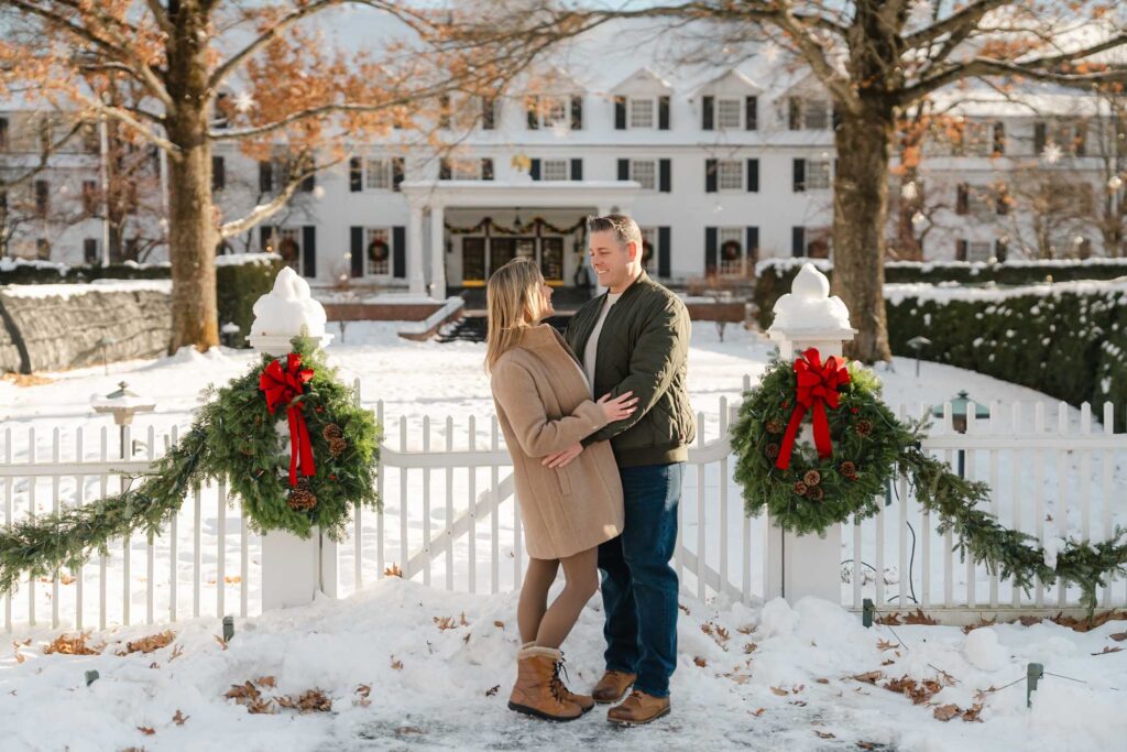 Couple pose in front of the woodstock inn