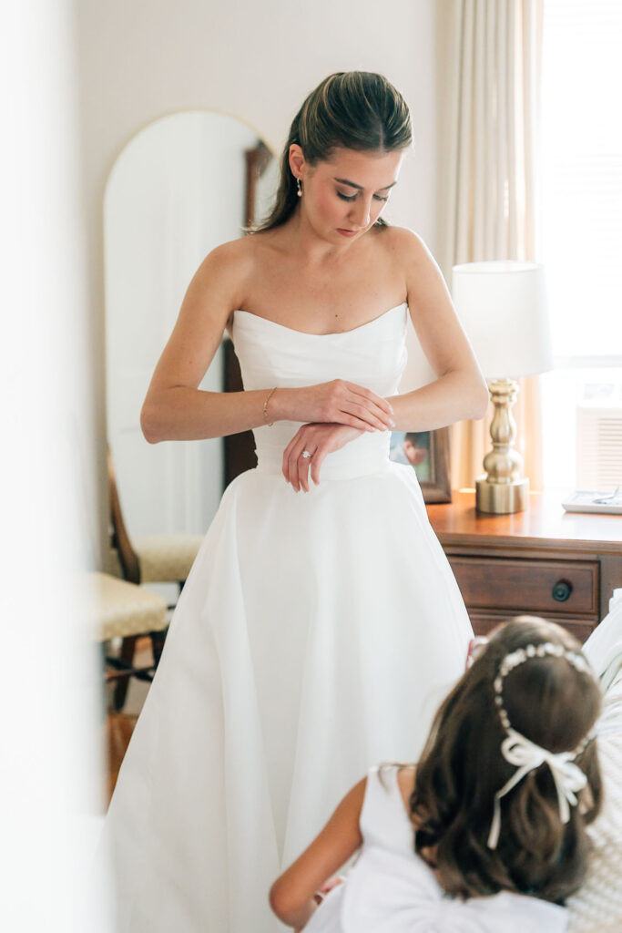 Harrington Farm Wedding - putting on bracelet