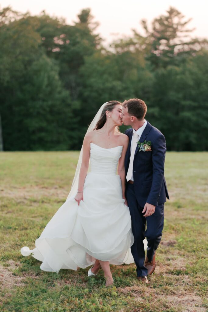 Harrington Farm Wedding - Bride and Groom kissing in field