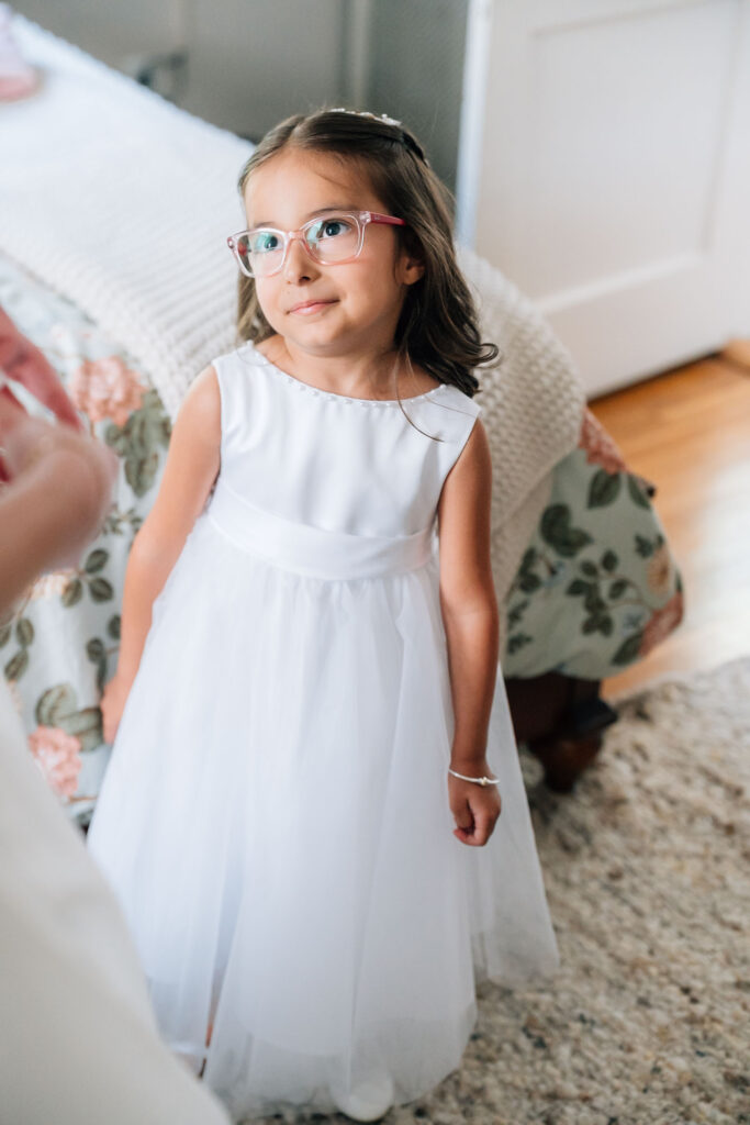 Harrington Farm Wedding - flower girl looking up