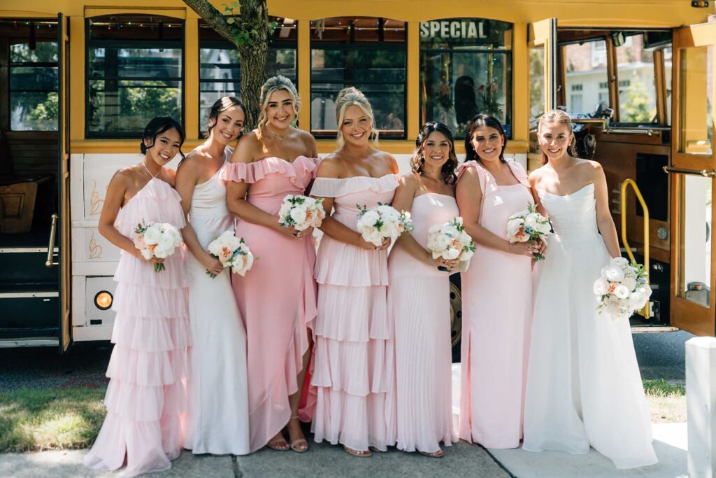 Harrington Farm Wedding - bridesmaids in front of trolley