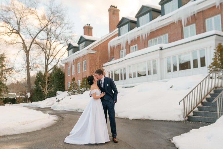 Couple kissing during Woodstock Inn Winter Wedding