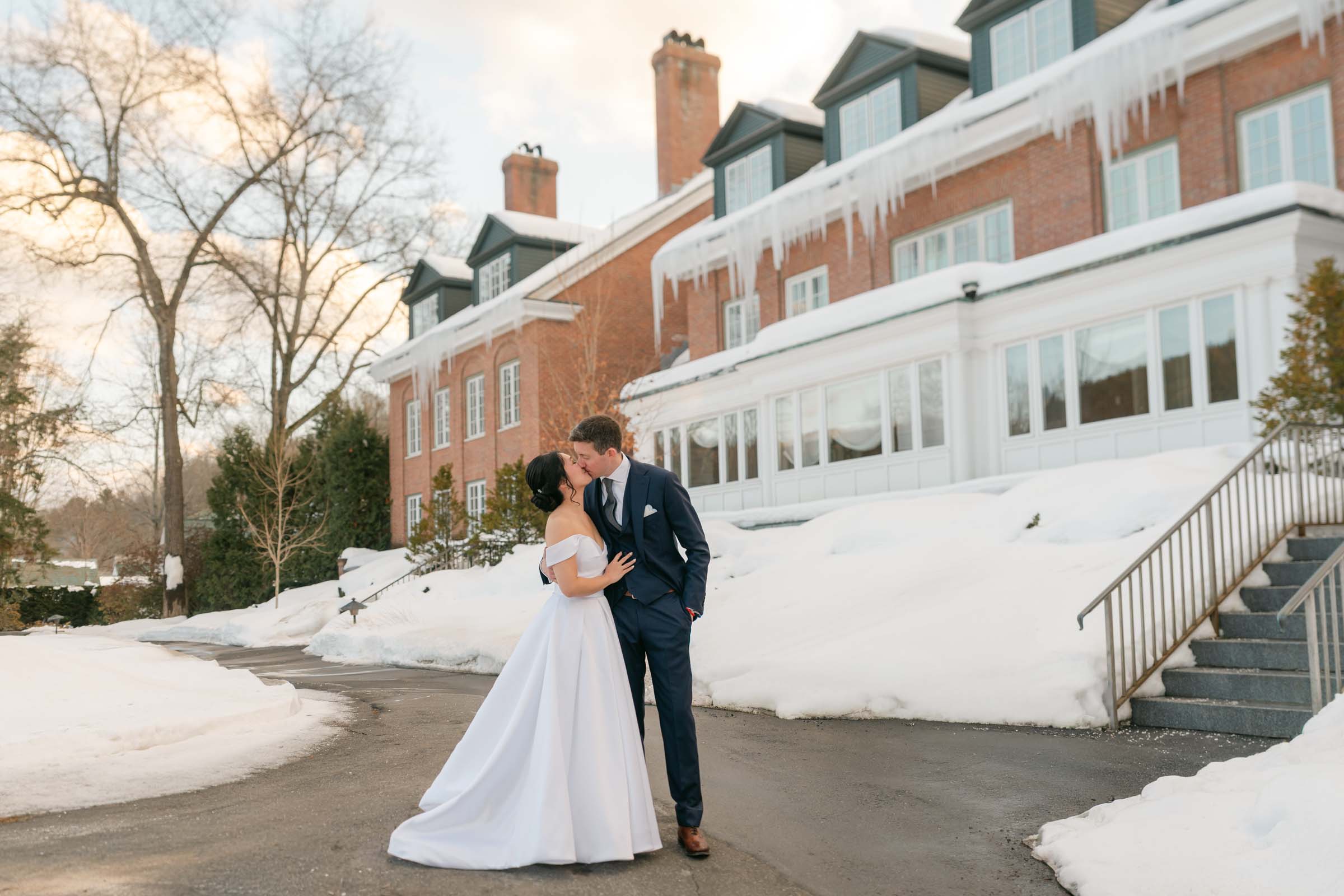 Couple kissing during Woodstock Inn Winter Wedding