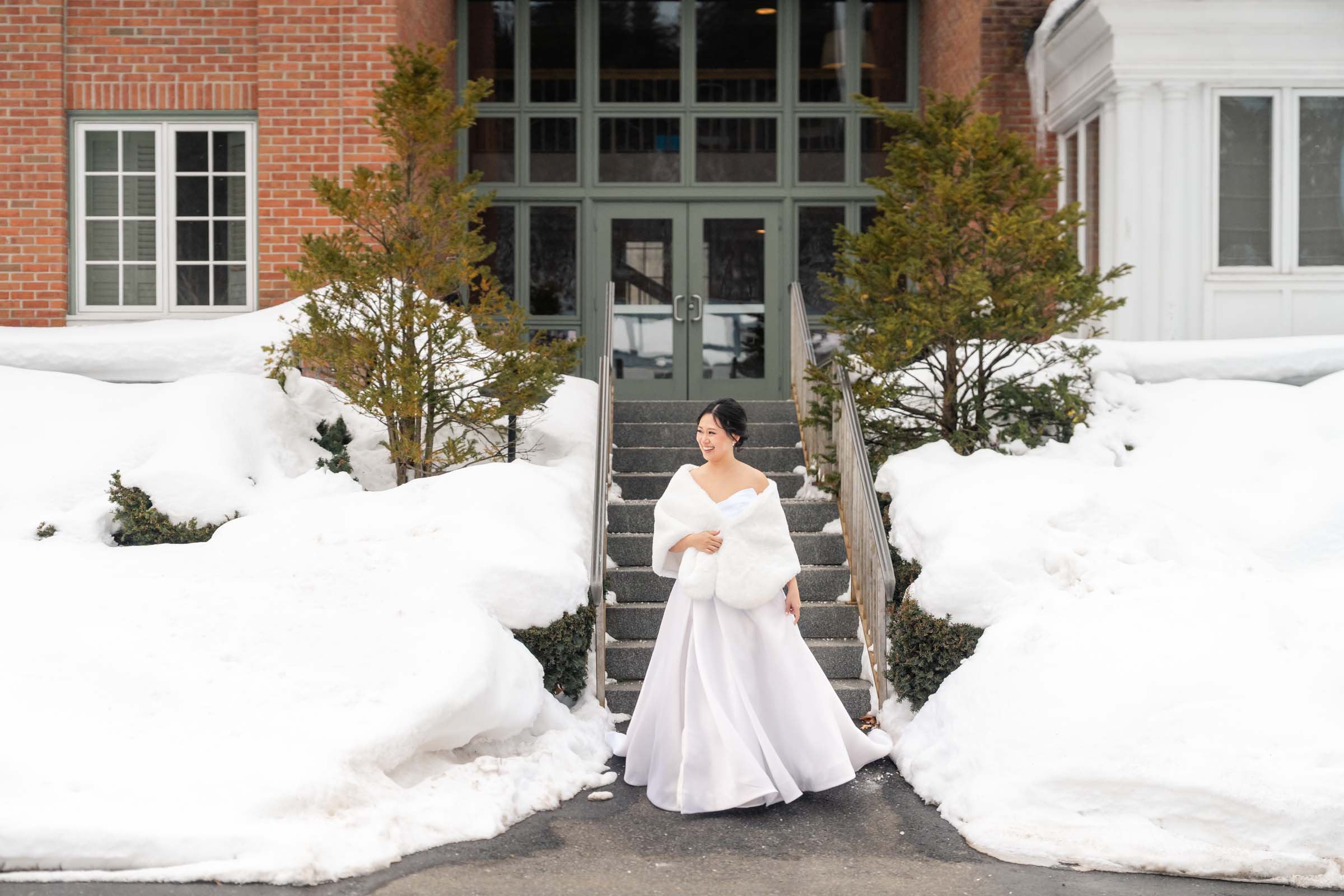 Woodstock Inn Winter Wedding - bride descending staircase