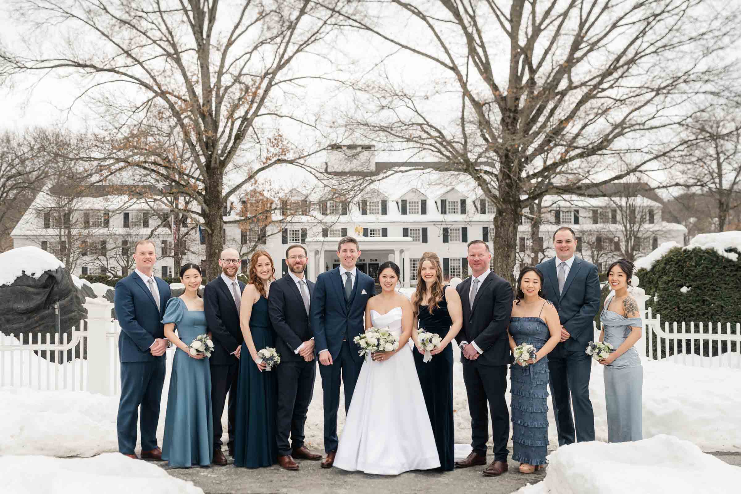 Woodstock Inn Winter Wedding - wedding party in front of gates
