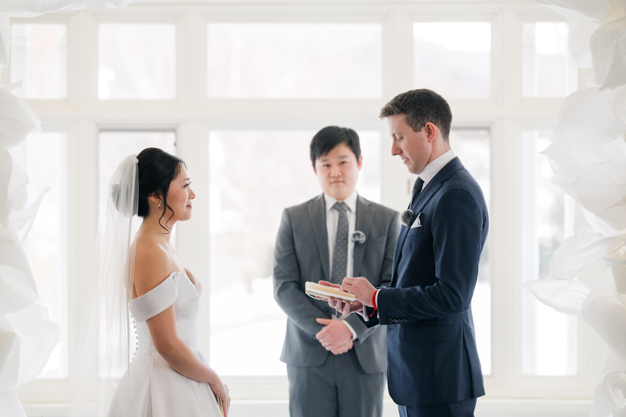Woodstock Inn Winter Wedding - couple saying vows during ceremony